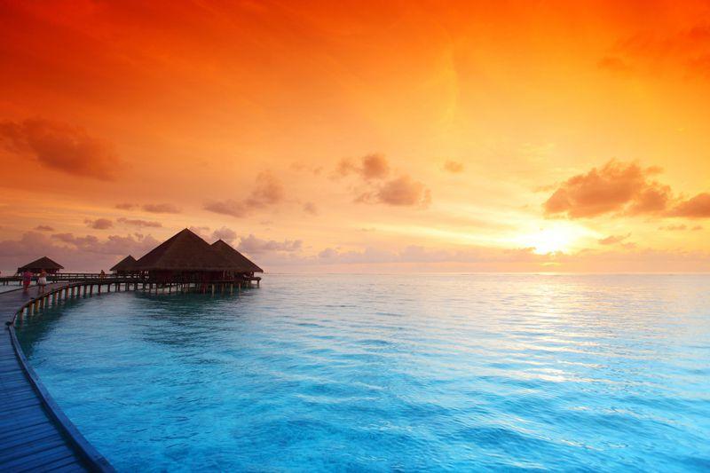 Carta da parati Bungalow al tramonto alle Maldive